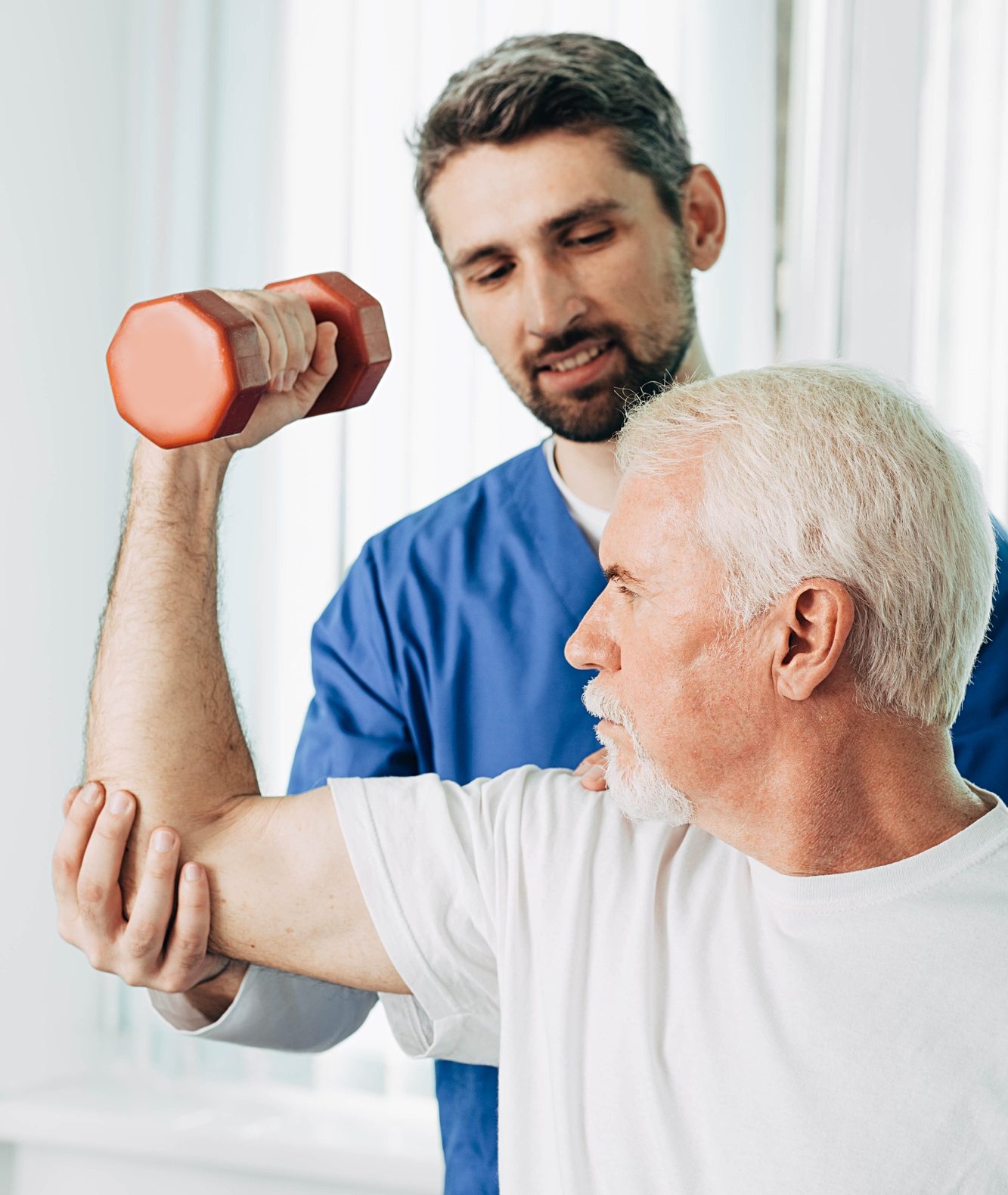 senior man lift a dumbbell, he doing treatment exercise with his physiotherapist. Physio treatment