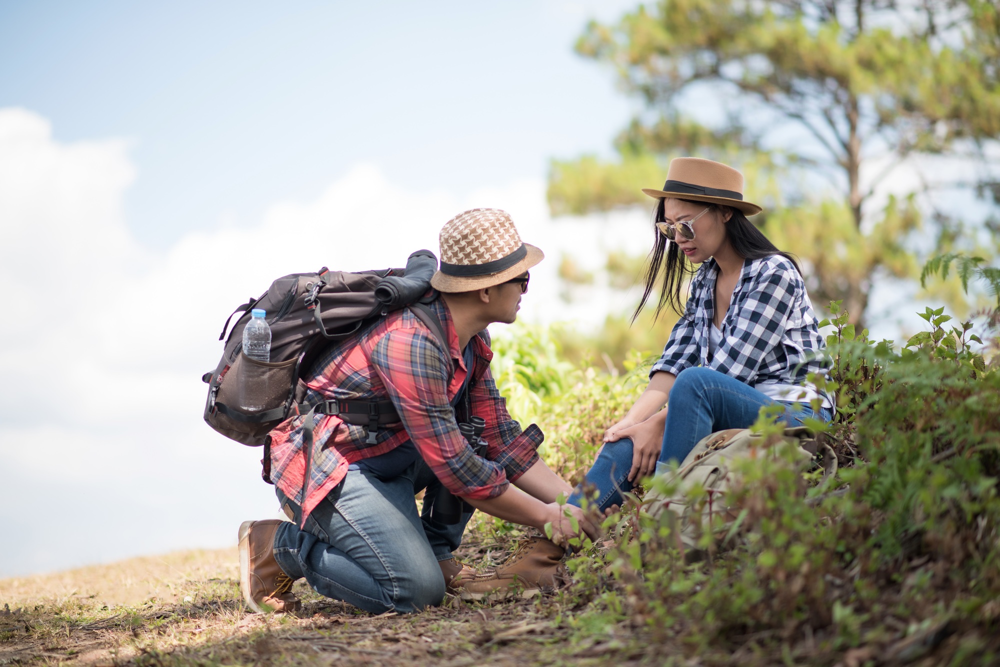 Young woman hiking muscle pain.